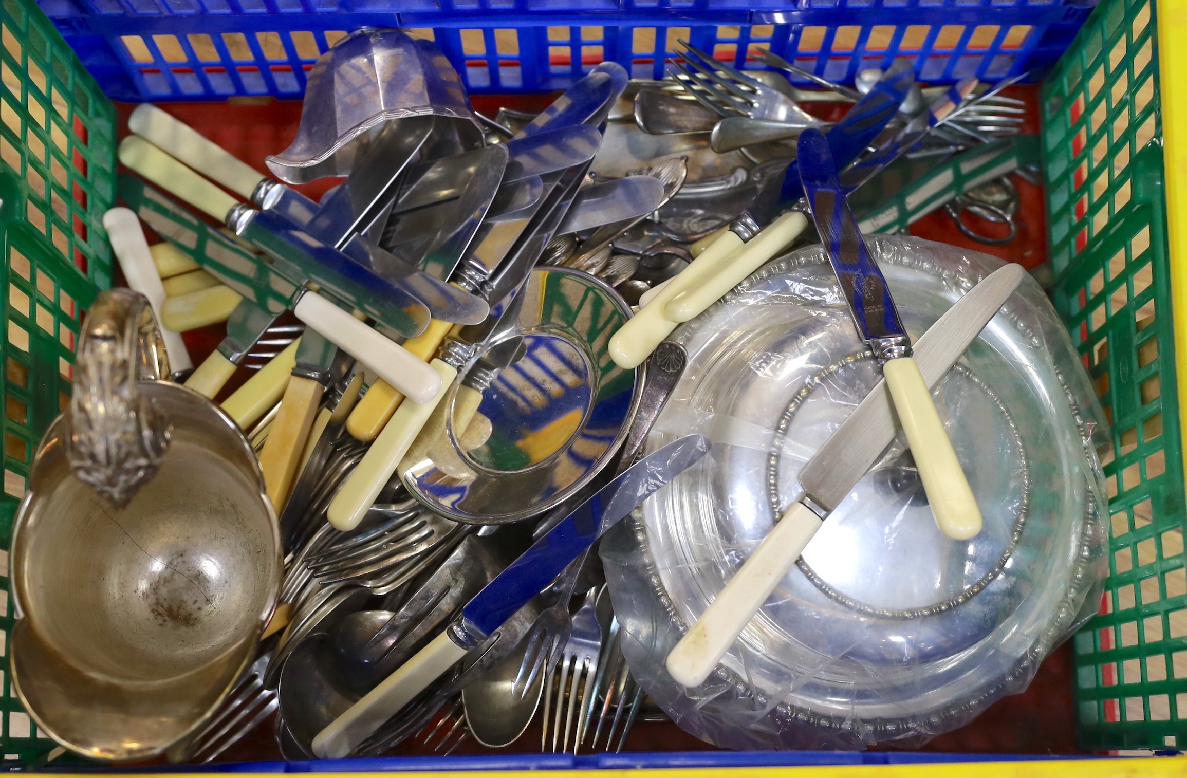 Assorted plated wares including a large jug, a salver, a snuffer stand and cutlery